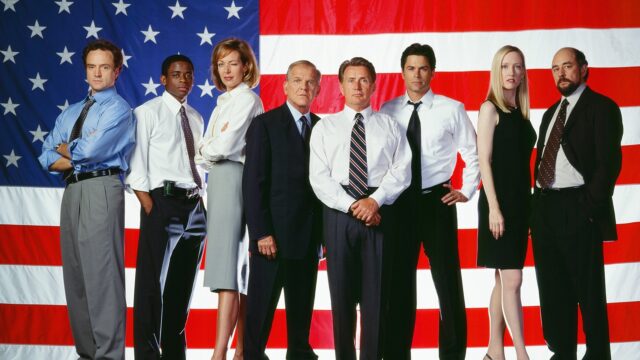 The West Wing TV Series Cast Standing United in Front of American Flag Wallpaper
