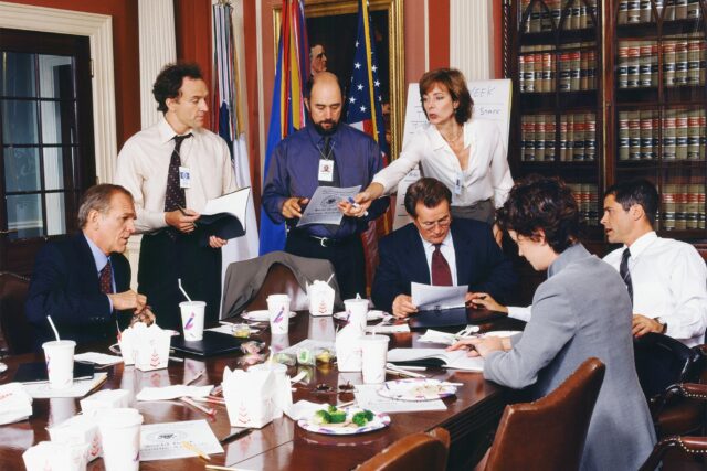 The West Wing TV Series Scene Team Meeting and Discussing Documents in Office