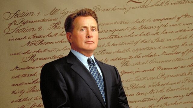 The West Wing TV Series Wallpaper Featuring President Bartlet in Front of Historic Text Background