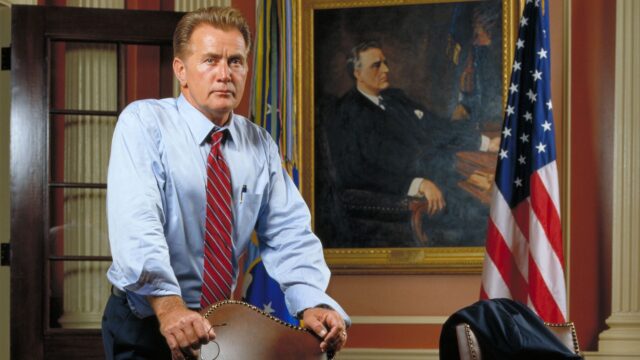 The West Wing TV Series Wallpaper Featuring President Bartlet in Oval Office Setting