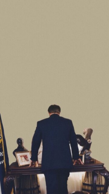 The West Wing TV Series Wallpaper Presidential Figure Standing Behind Desk with Eagle Statue