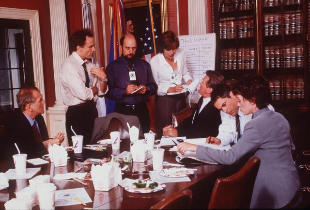 The West Wing Tv Series Wallpaper Intense Political Staff Meeting Scene