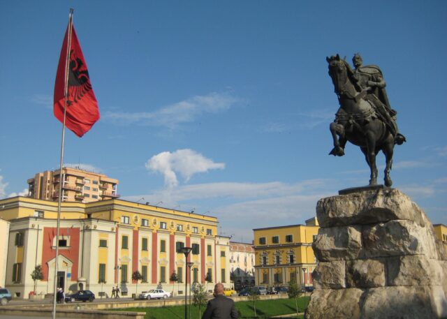 Tirana Albania Cityscape With Skanderbeg Statue And Flag