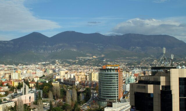 Tirana Albania Scenic Cityscape With Mountain Backdrop Wallpaper