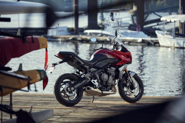 Triumph Tiger Sport 660 Motorcycle Parked on Waterfront Dock Wallpaper