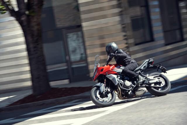 Triumph Tiger Sport 660 Motorcycle Riding on Urban Street Wallpaper