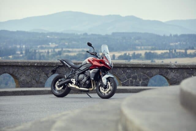 Triumph Tiger Sport 660 Red Motorcycle Parked Scenic Mountain Background Wallpaper