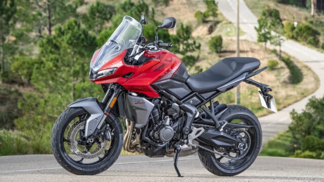 Triumph Tiger Sport 660 Red Motorcycle Parked on Scenic Road Wallpaper