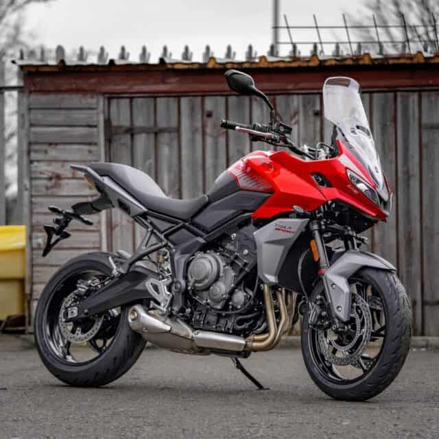Triumph Tiger Sport 660 Red Motorcycle Parked on Street Wallpaper