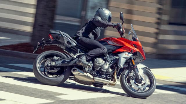 Triumph Tiger Sport 660 Riding Action on Urban Road Stunning Motorcycle Wallpaper