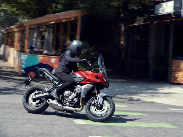 Triumph Tiger Sport 660 Riding on City Road High Quality Motorcycle Wallpaper