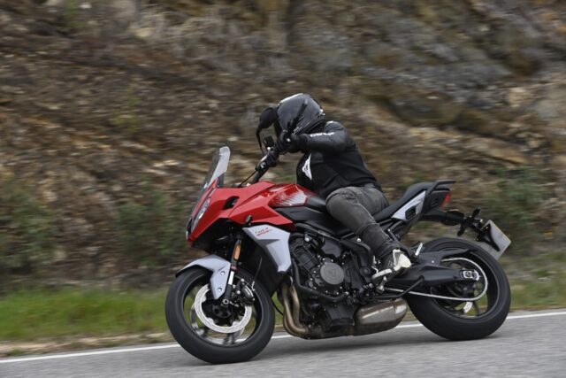 Triumph Tiger Sport 660 Riding on Scenic Mountain Road Wallpaper