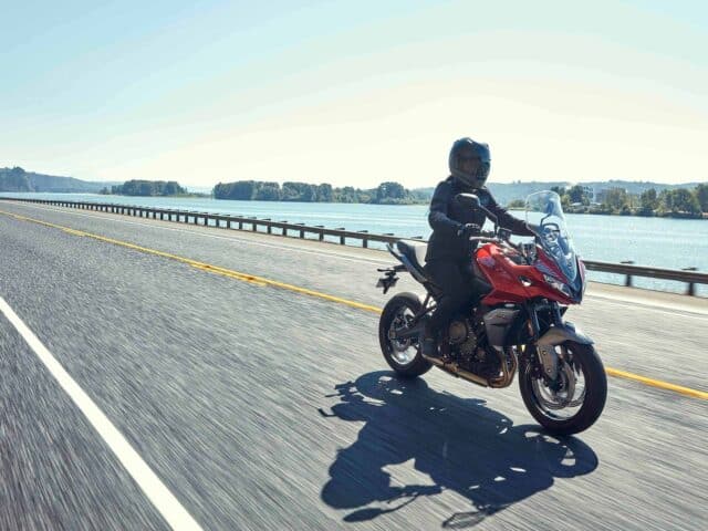 Triumph Tiger Sport 660 Riding on Scenic Open Road Wallpaper