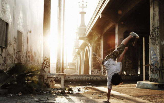 Urban Breakdancing Scene In Graffiti Alley Wallpaper