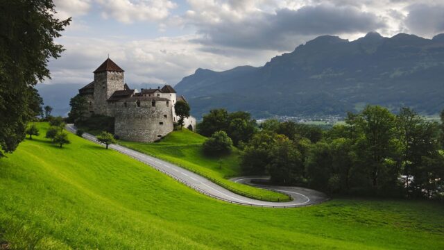 Vaduz Castle Scenic View Amidst Lush Green Landscape