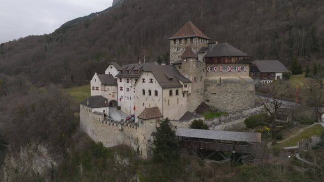 Vaduz Castle Surrounded By Scenic Hillside View