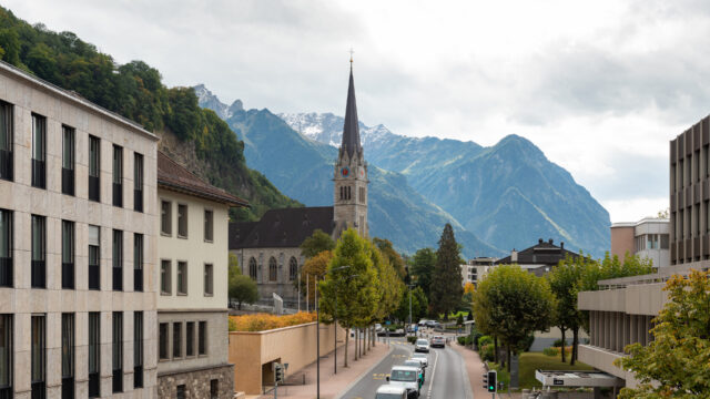 Vaduz Scenic View With Church And Mountains In Background