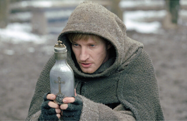 Van Helsing Monk Holding A Cross Flask In Winter Scene