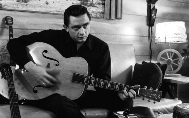Vintage Johnny Cash Playing Guitar Wallpaper