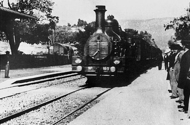 Vintage Train Scene Captured By Lumiere Brothers Historic Wallpaper