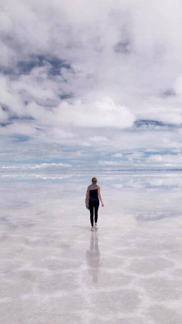 Walking on the reflective salt flats of Salar De Uyuni Bolivia wallpapers