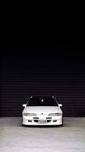 A white Honda Integra is parked in front of a black shutter with a visible license plate PSI H8R, 2K Phone Wallpaper