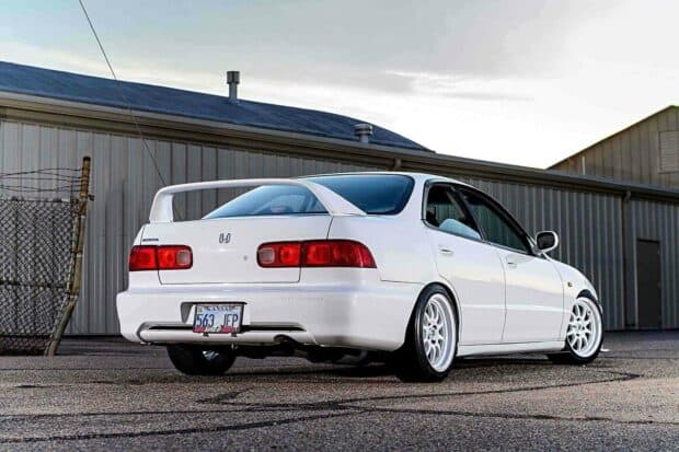 A white Honda Integra is parked outdoors showing its rear design and sporty wheels, HD Desktop Wallpaper