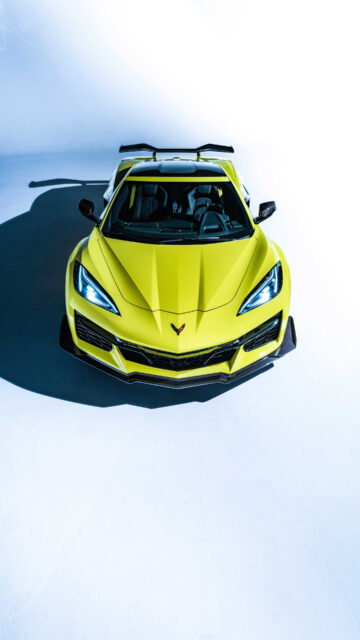 Yellow Chevrolet Corvette Front View High Contrast Wallpaper Perfect For Car Enthusiasts