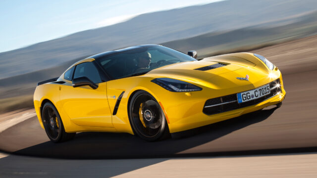 Yellow Chevrolet Corvette On Race Track Stunning Sports Car Wallpaper