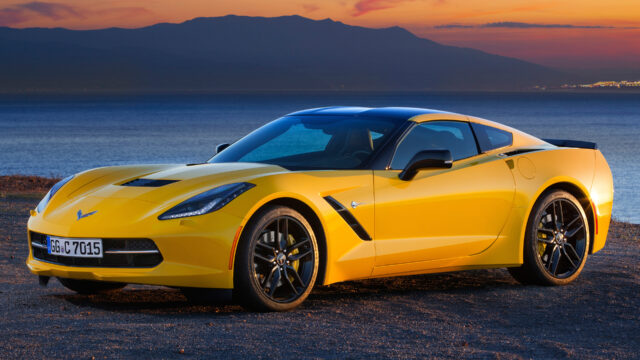 Yellow Chevrolet Corvette Parked By The Ocean At Sunset Stunning Chevrolet Corvette Wallpapers Background