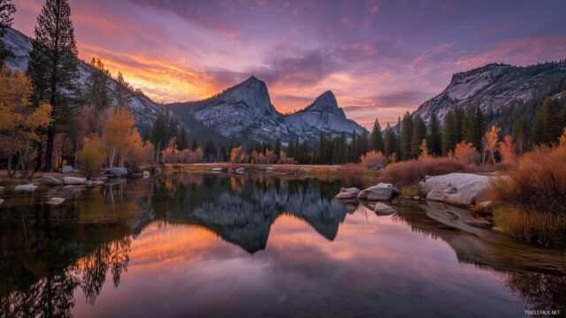 Yosemite National Park wallpaper HD, vibrant sunset behind the granite peaks reflecting on a serene lake.