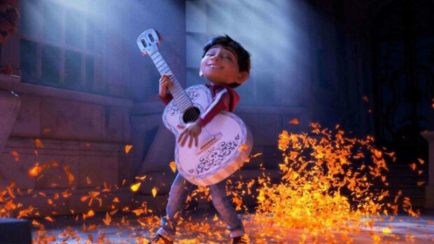 A young boy joyfully plays a guitar surrounded by glowing orange petals in a Coco cartoon scene, HD Desktop Wallpaper