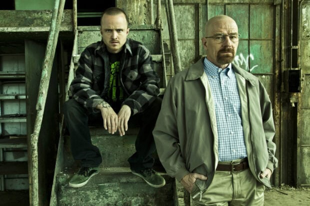 Aaron Paul and Bryan Cranston pose in an industrial setting in a Breaking Bad scene, HD Desktop Wallpaper