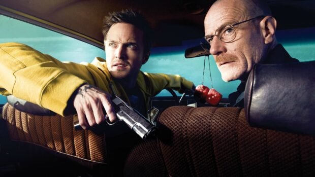 Aaron Paul holds a gun inside a car with Bryan Cranston next to him, HD Desktop Wallpaper