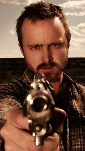 Aaron Paul aims a gun directly at the camera with a serious expression, HD Mobile Wallpaper