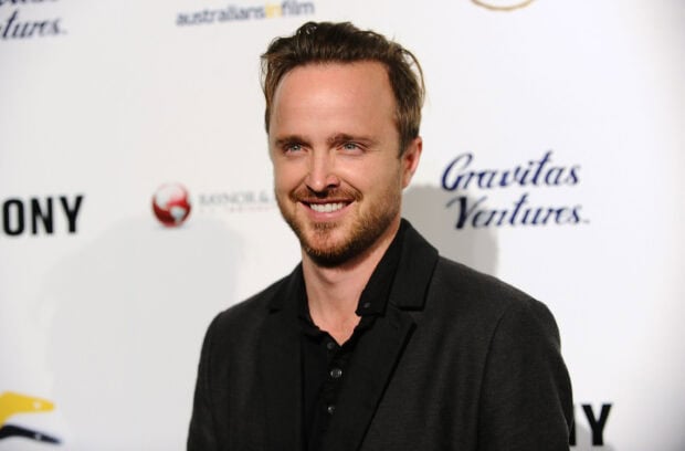 Aaron Paul smiles warmly while attending an event in a black jacket, 2K Desktop Wallpaper