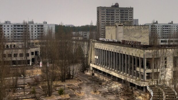 The ghost town features decaying buildings with bare trees and empty streets, HD Desktop Wallpaper