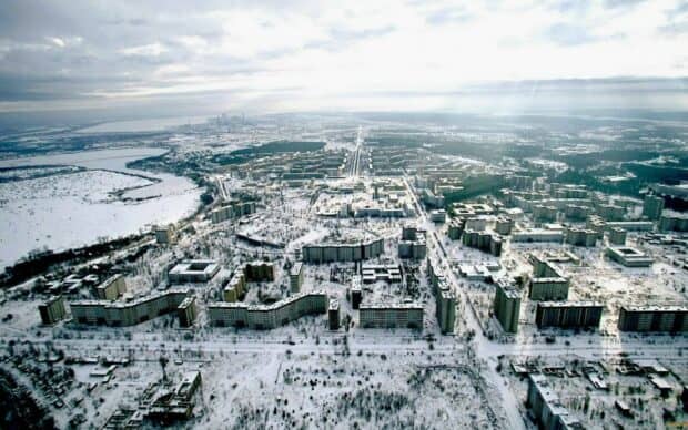 An aerial view of a ghost town covered in snow during winter, HD Desktop Wallpaper