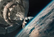 A large space station is orbiting Earth with several smaller spacecraft nearby in space, 4K Desktop Wallpaper