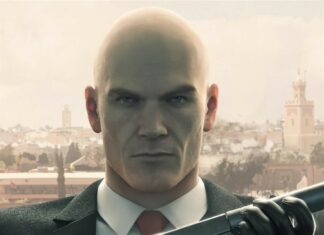 Agent 47 is holding a silenced pistol outdoors in the Hitman game, HD Mobile Wallpaper