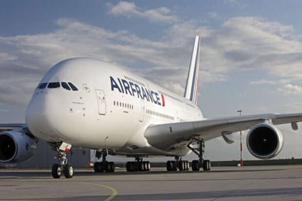 An Air France Airbus A380 is parked on the runway with its engines and landing gears visible, HD Desktop Wallpaper
