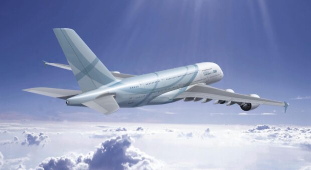 The Airbus A380 is flying high above the clouds on a clear day, 2K Desktop Wallpaper