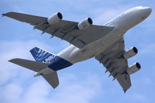 The Airbus A380 is shown soaring through a bright blue sky in this image, HD Desktop Wallpaper