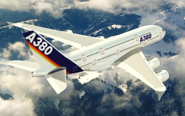 An Airbus A380 flies above snowy mountains with a clear sky background, HD Desktop Wallpaper
