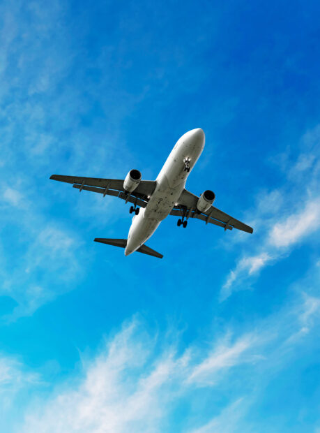 An Airbus A380 is flying in the clear blue sky with clouds below, HD Mobile Wallpaper