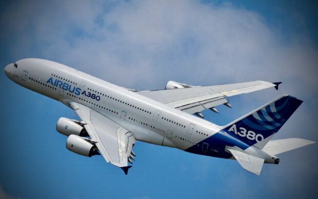 The Airbus A380 is flying gracefully in the blue sky, 2K Desktop Wallpaper