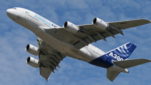 An Airbus A380 aircraft is flying with its landing gear retracted under a clear blue sky, HD Desktop Wallpaper
