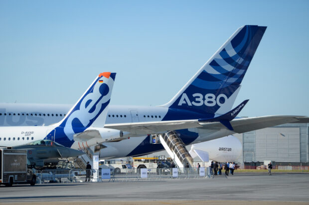 The Airbus A380 tail with logo and part of the aircraft on a clear day, 2K Desktop Wallpaper