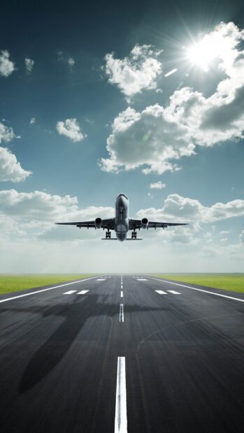 An aircraft is lifting off from the runway under a partly cloudy sky, HD Mobile Wallpaper