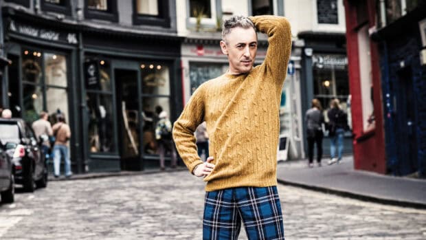 Alan Cumming wallpapers show him posing confidently on a city street, HD Desktop Wallpaper